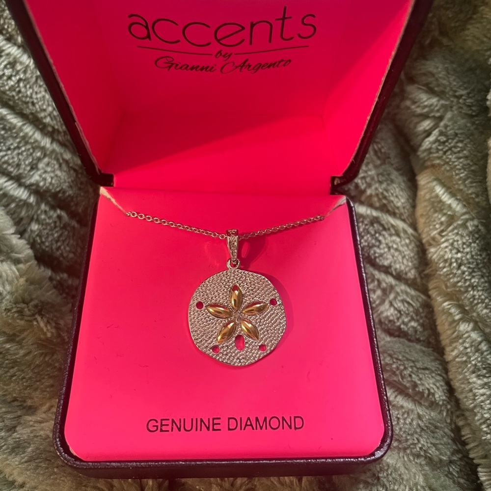 Necklace with a sand dollar charm
